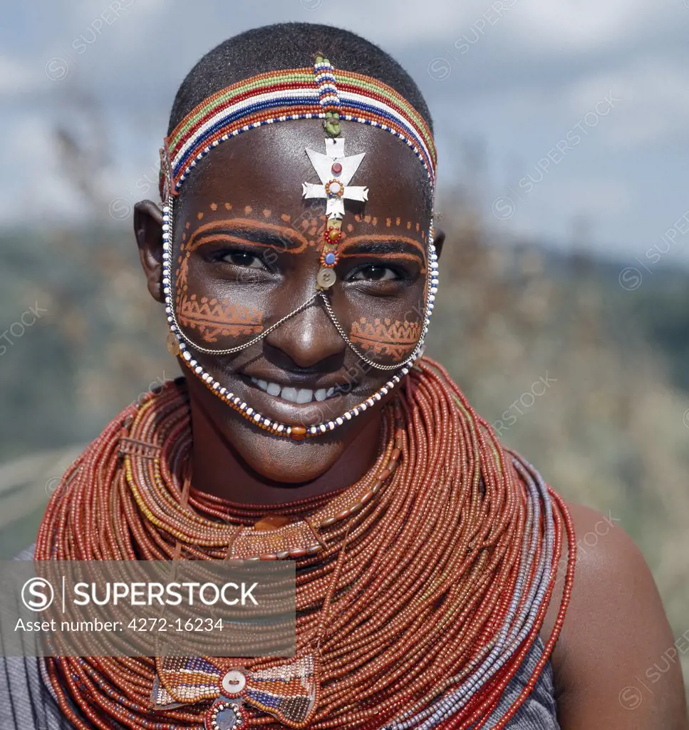 Samburu girls are given strings of beads by their fathers when they are still young.  As soon as they are old enough to have lovers from the warrior age set, they regularly receive gifts from them. Over a period of years, their necklaces can smother them up to their necks.