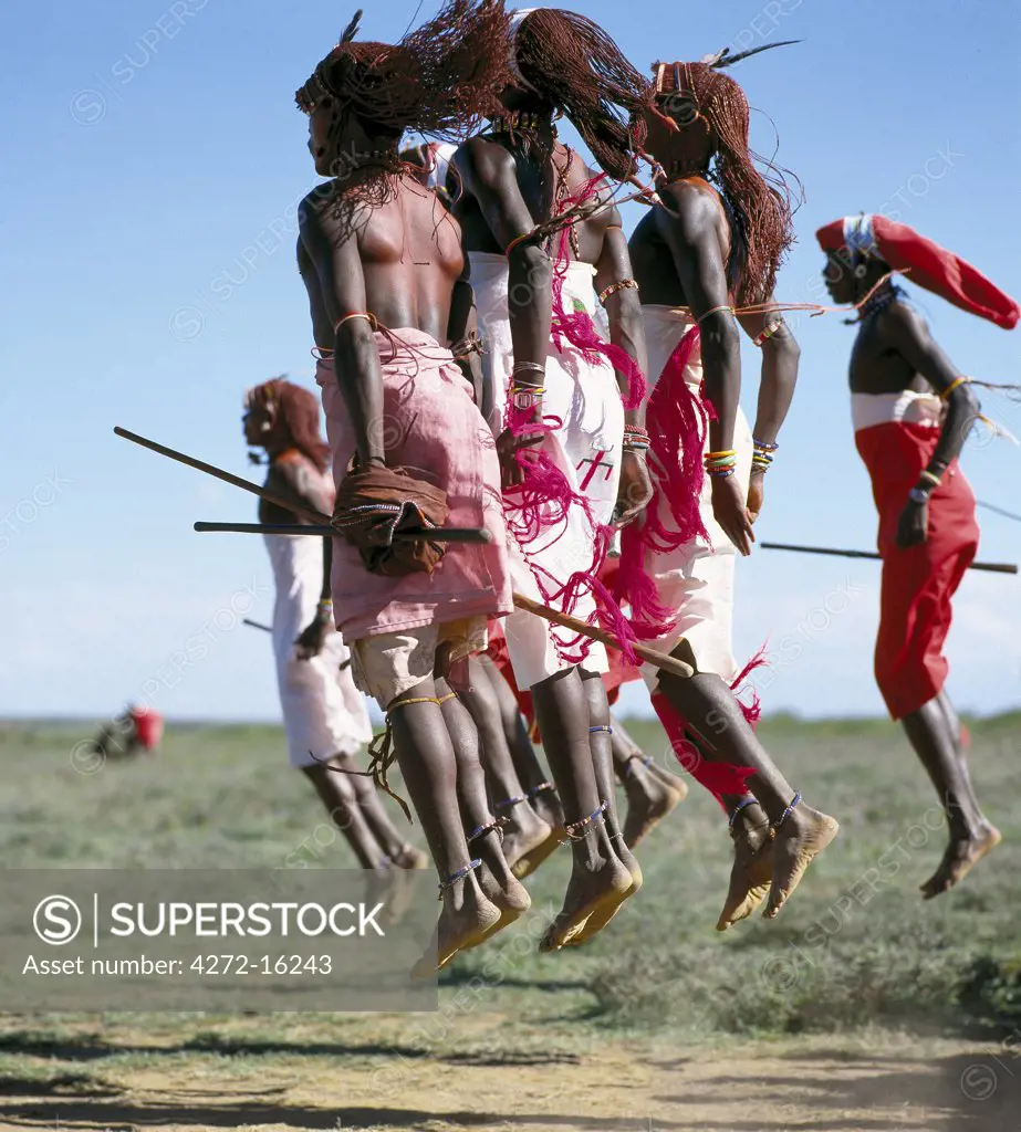 In their dances, Samburu warriors take it in turns to leap high in the air from a standing position without bending their knees.  This is achieved by flexing their ankles in a seemingly effortless way.  Their long Ochred braids distinguish them from other members of their society.
