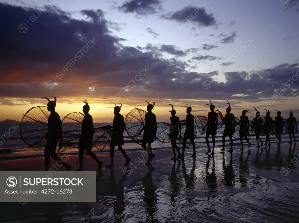 As the sun rises over Lake Turkana, a group of fishermen set out with their traditional fishing baskets to catch talapia in the lake's shallow waters.  These traditional methods of fishing are now rare because the introduction of small mesh gillnets has resulted in a marked decline of fish stocks close to the shore.