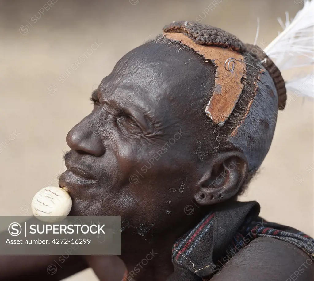 Turkana elders wear decorative ivory lip ornaments, secured in position by a spigot which is inserted in a hole pierced below the man's lower lip after initiation.  This singular form of decoration was once widespread but is rarely seen today. Likewise, the traditional clay hairdo is gradually dying out.