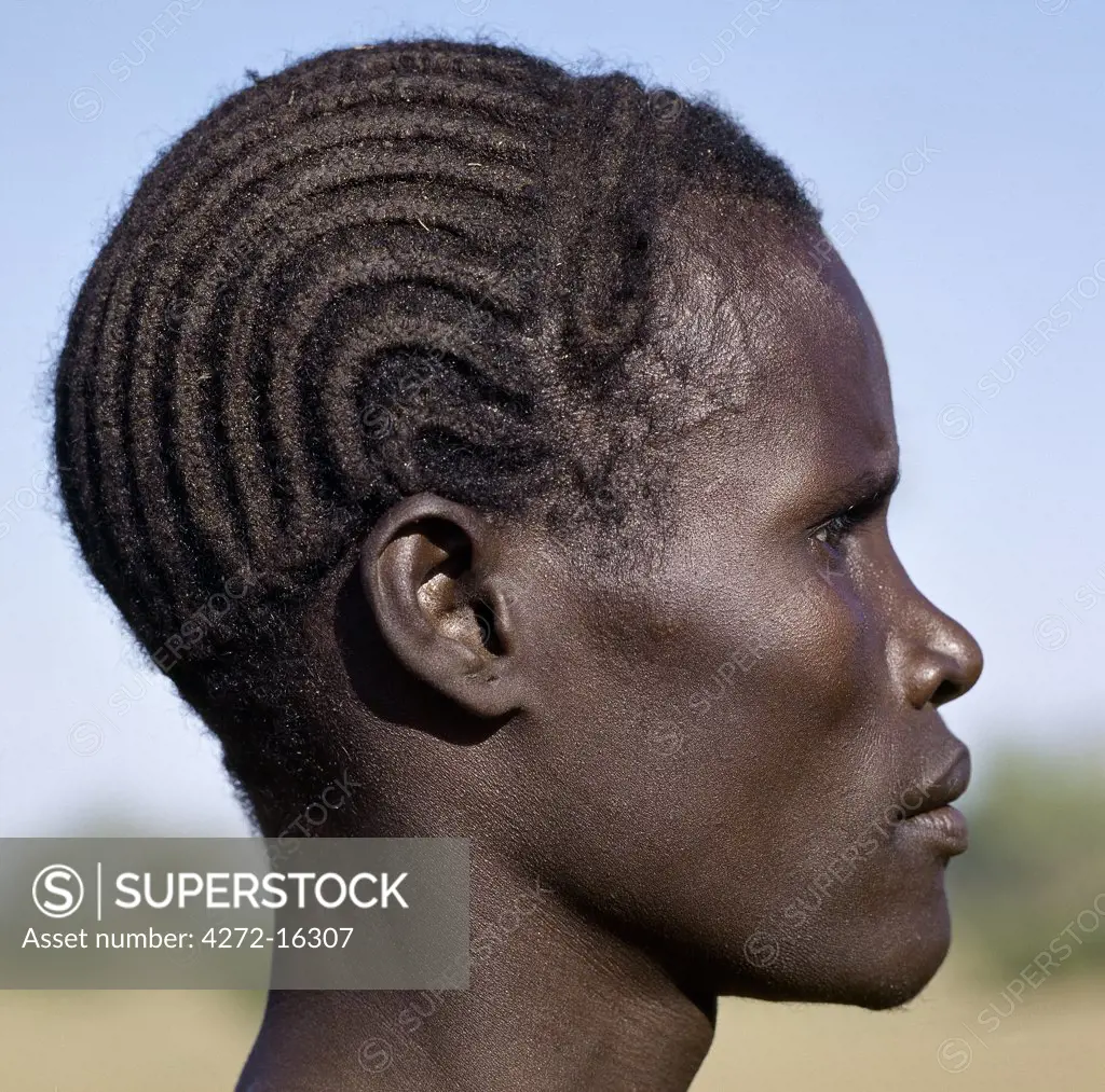 A young Turkana man with a braided hairstyle.