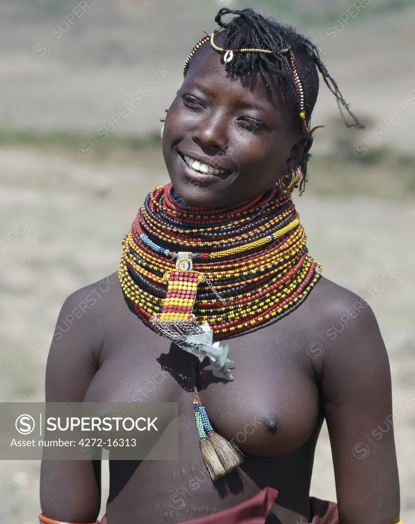 An attractive young Turkana girl wearing all the finery of her tribe.