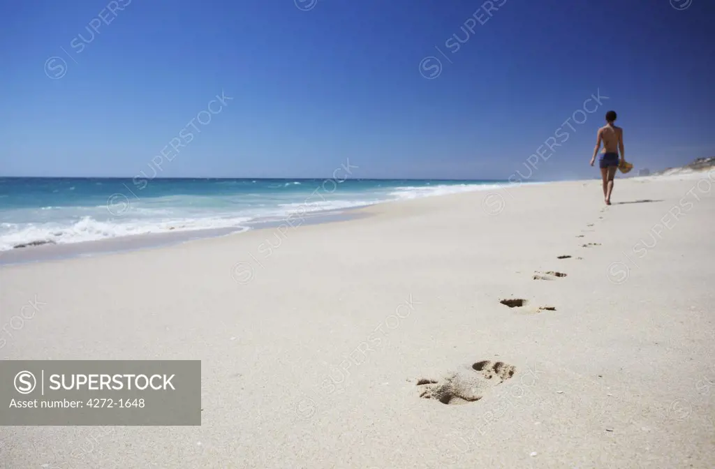 Woman walking on Floreat beach, Perth, Western Australia, Australia (MR)