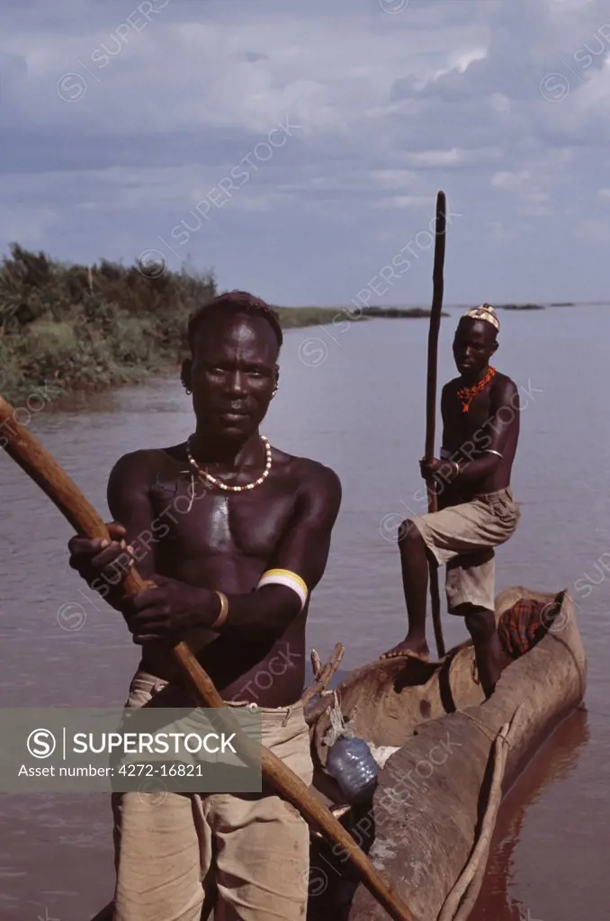 El Molo fishermen in their dugout canoe on the fringe of the Omo Delta.  The El Molo are reputedly Kenya's smallest tribe, a group of nomadic fishermen who fish the Omo delta and Lake turkana.