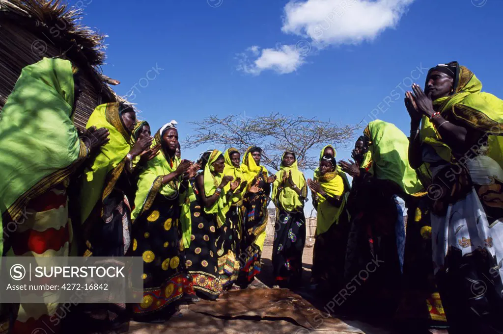 Gabbra women dance at a gathering in the village of Kalacha.  The Gabbra are a Cushitic tribe of nomadic pastoralists living with their herds of camels and goats around the fringe of the Chalbi Desert.