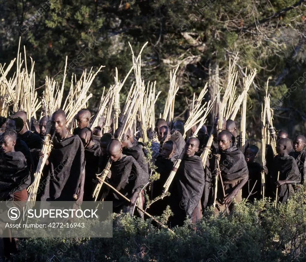 Mothers rub animal fat into their sons cloaks to make them supple.  This task is performed shortly before the boys set out on an arduous journey to collect sticks, staves and gum to make bows, blunt arrows and clubs after their circumcision.