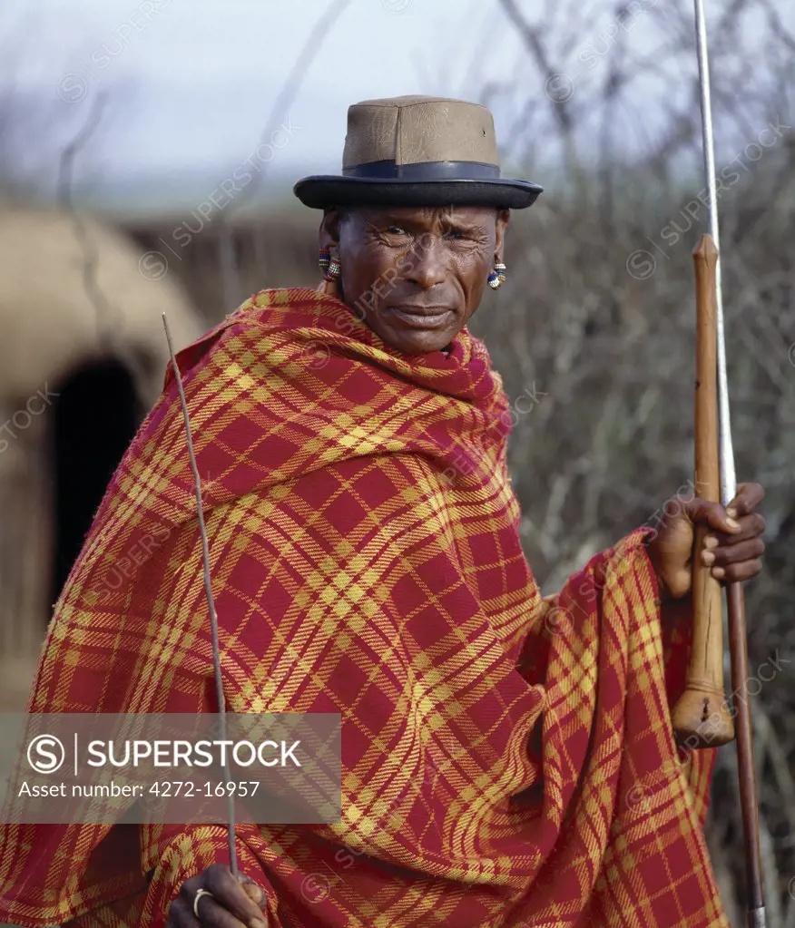 A blanket-clad Samburu elder.  In the days leading up to his son's circumcision, he becomes distinctly nervous of his son's conduct during the operation.  Should a boy show signs of fear or cry out, he brings terrible shame to his family.