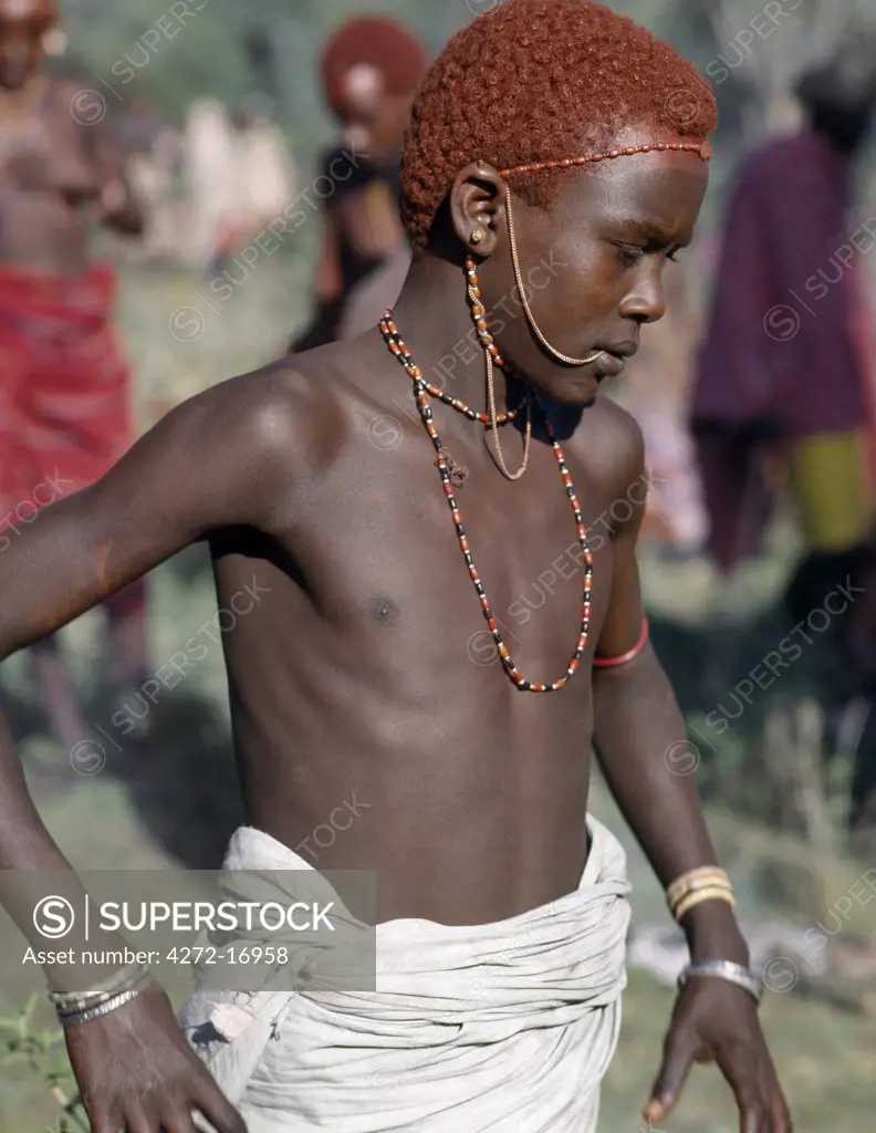 A young Samburu warrior.  In the days leading up to a circumcision ceremony, everyone becomes distinctly nervous of the conduct of the family members' undergoing the operation.  Should a boy show signs of fear or cry out, he brings terrible shame to his entire family.