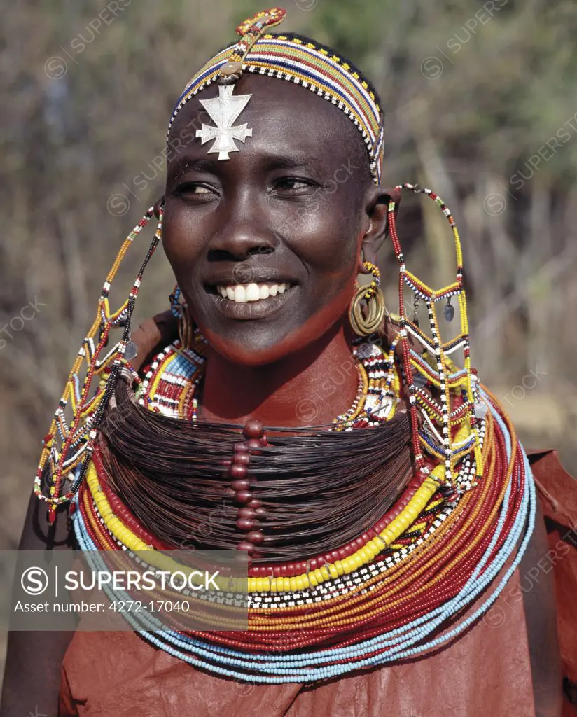 A Samburu woman wearing a mporro necklace, which signifies her married status.These necklaces, once made of hair from giraffe tails, are now made from fibres of doum palm fronds (Hyphaene coriacea).  The beads are mid-19th century Venetian glass beads, which were introduced to Samburuland by early hunters and traders.