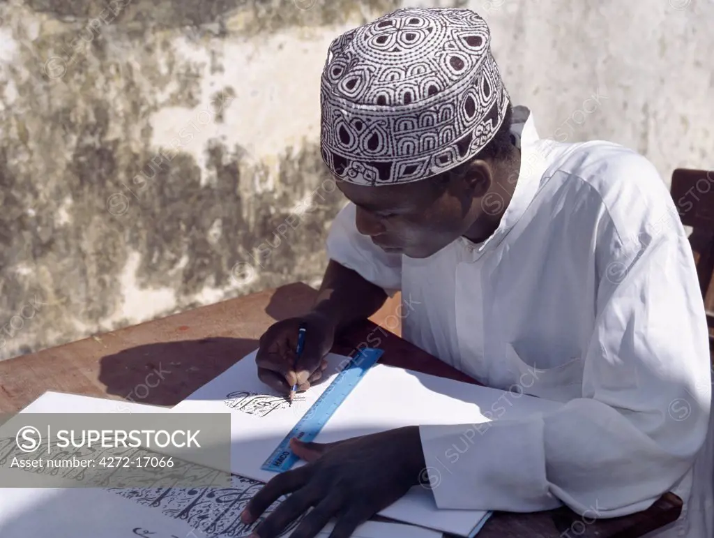 A Swahili student in Lamu practices Arabic calligraphy.  Each year, students on the island participate in a competition to keep this art alive. Situated 150 miles north northeast of Mombasa, Lamu town dates from the 15th century AD.