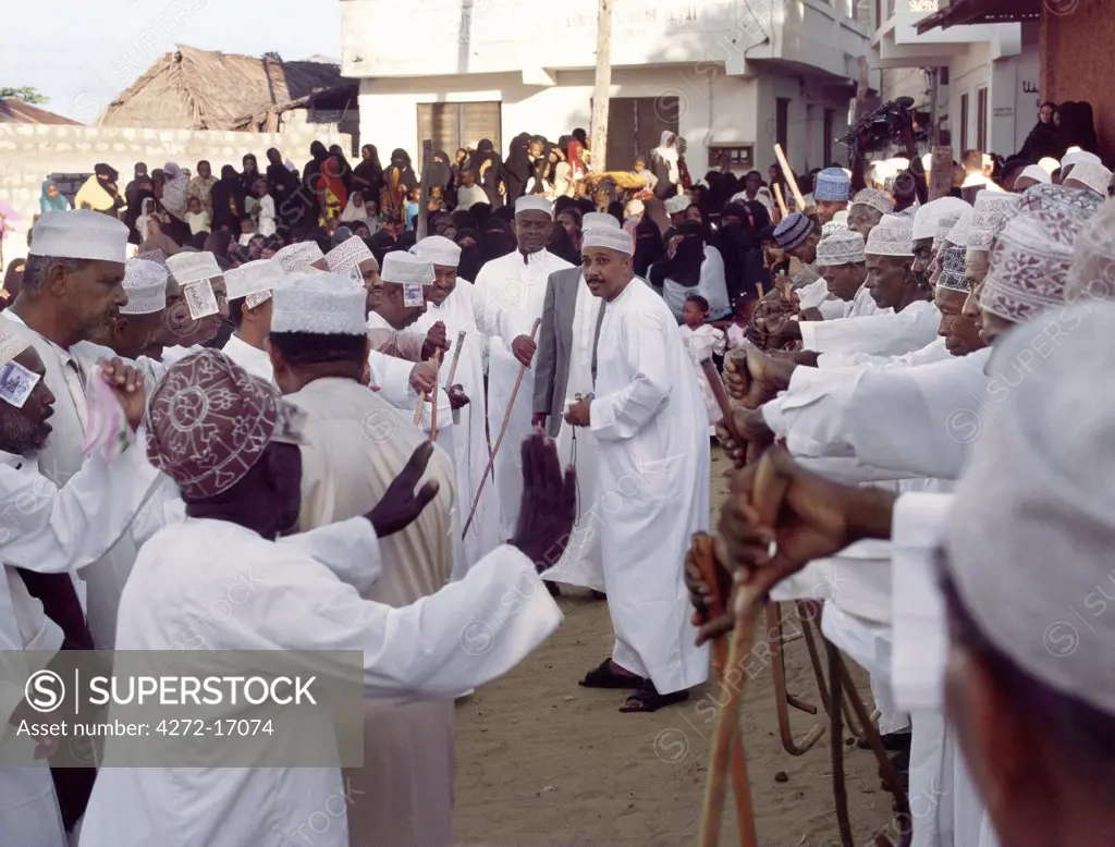 In the late afternoon, Lamu men in traditional Islamic dress gather to dance and sing in the square outside the Riyadha Mosque to celebrate Maulidi, the Prophet Mohameds birthday. This is a major event in Lamu and attracts pilgrims from all over East Africa and sometimes farther afield.