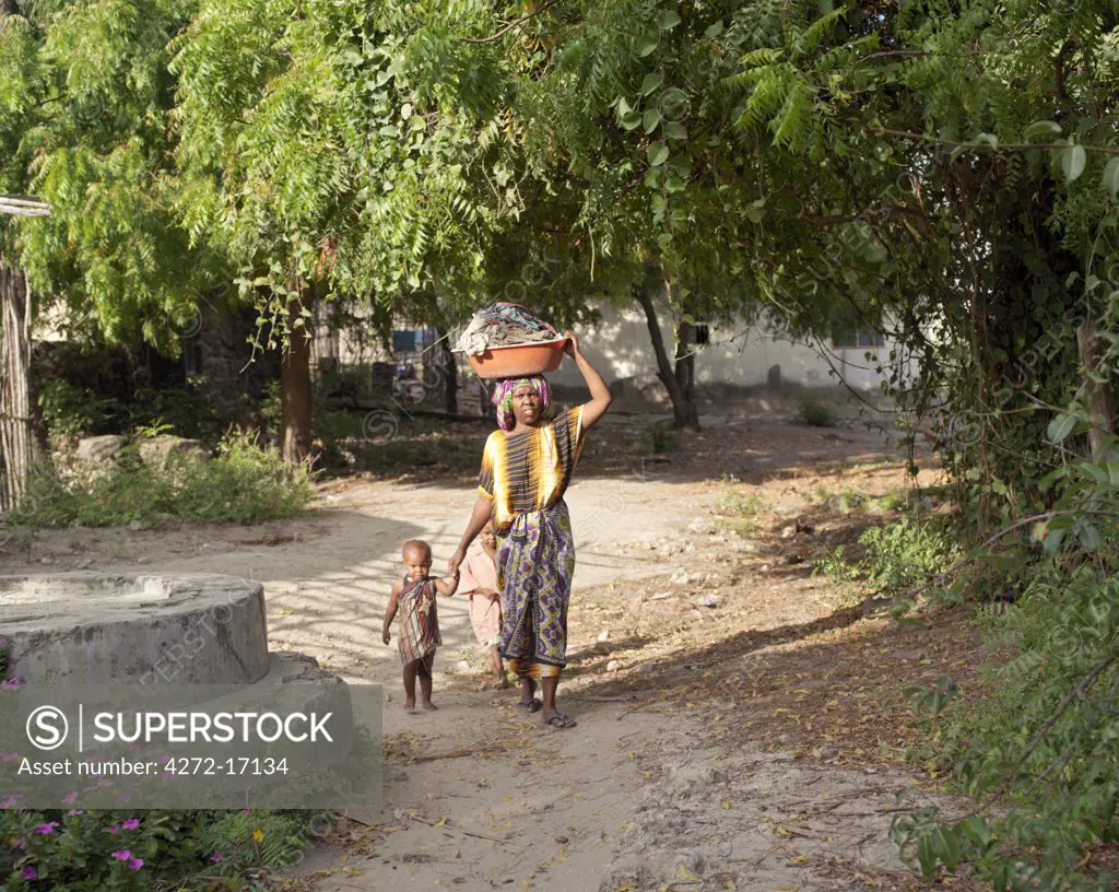 A woman and her children at Faza village on Pate Island, which can only be approached by sailing boats at high tide along a tidal inlet lined with mangrove trees. The chequered history of Faza dates back several hundred years.