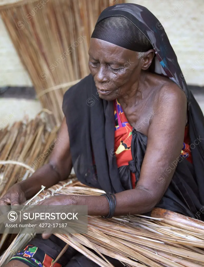 A Swahili woman in Lamu makes makuti, a coconut palm thatch used extensively as a roofing material on houses all along the East African Coast. Situated 150 miles north northeast of Mombasa, Lamu town dates from the 15th century AD.