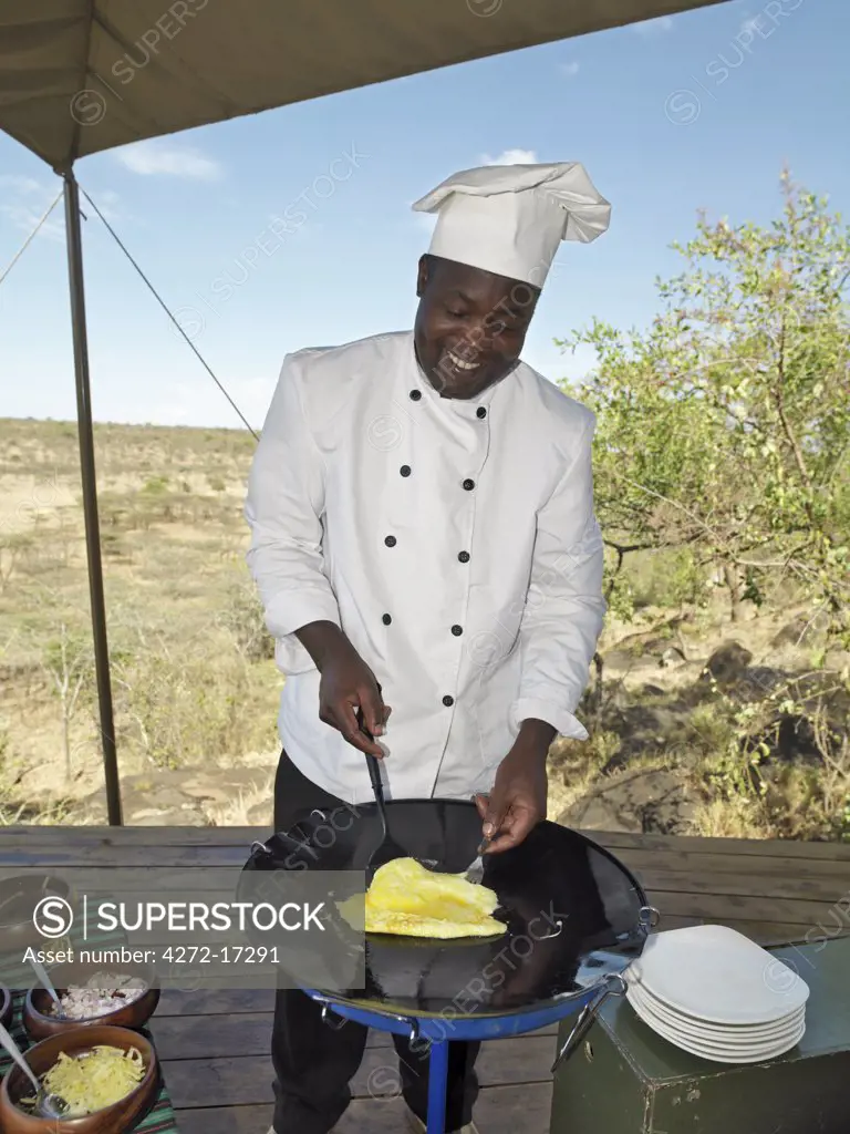 A chef at Ol Seki tented camp in Masai Mara Game Reserve prepares breakfast for guests.