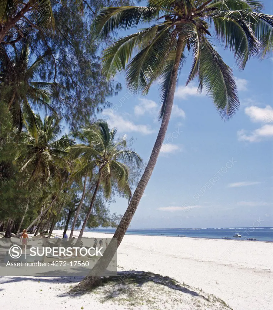 Africa, Kenya, Kwale District, Diani Beach. White sands and coconut palms beside the Indian Ocean at Diana Beach, south of Mombasa.