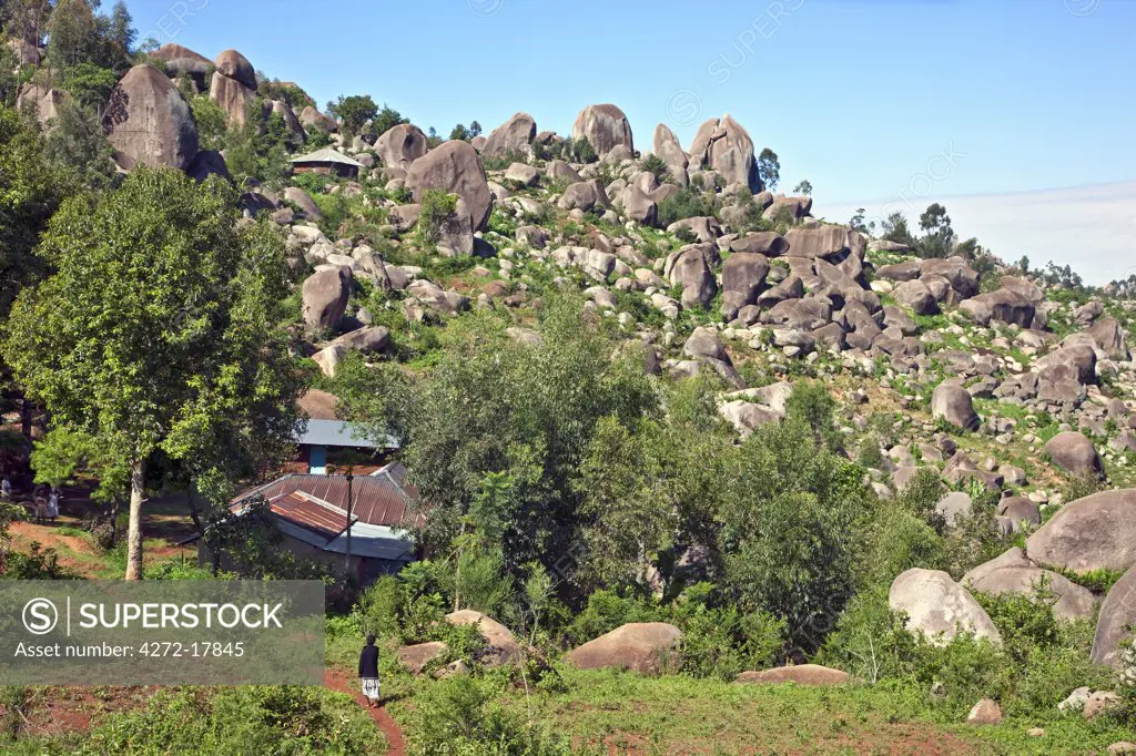 Kenya. Homesteads nestling among giant granite boulders in Western Kenya.