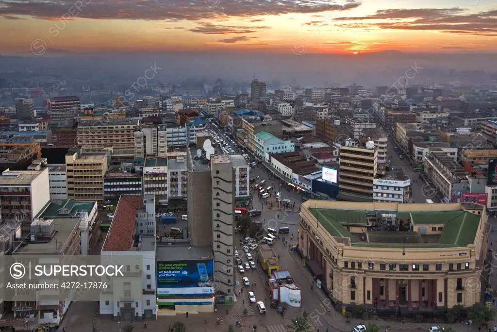 Kenya, Nairobi. Nairobi at sunrise with Mount Kenya (left) and Ol doinyo Sabuk rising in the far distance.