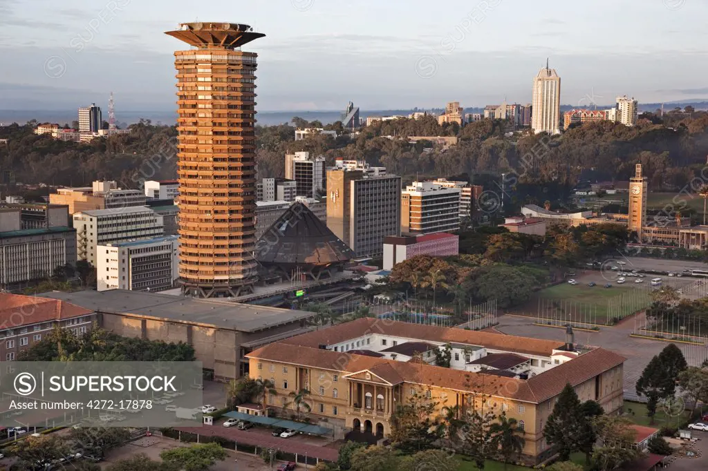 Kenya, Nairobi. Nairobi at sunrise with the circular tower of the Kenyatta Conference Centre in the foreground.
