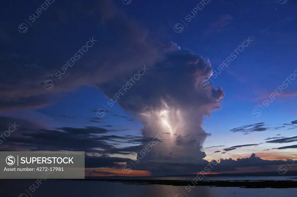 Kenya, Nyanza District. A violent evening storm with forked lightning over Lake Victoria .