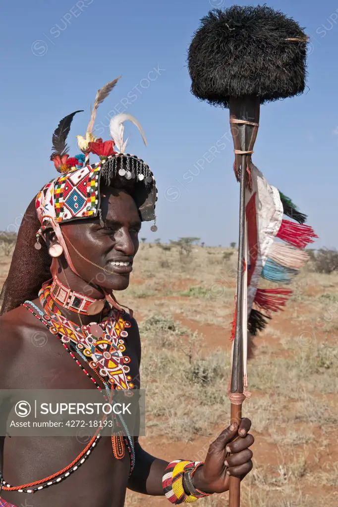 Kenya, A Samburu warrior of Northern Kenya in all his finery. The ostrich pompom on top of his spear was formerly a sign of peace.