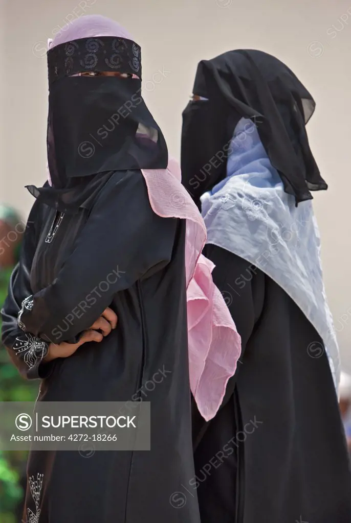 Kenya. Lamu women in fashionable Muslim dress.