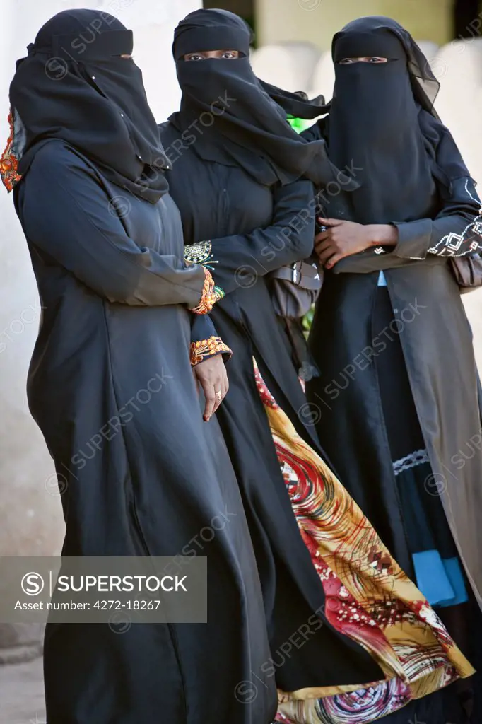 Kenya. Lamu women in fashionable Muslim dress.