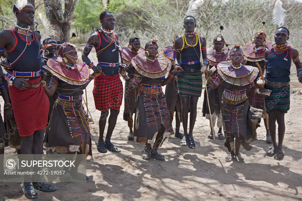 Young Pokot men and women dancing to celebrate an Atelo ceremony. The Pokot are pastoralists speaking a Southern Nilotic language.