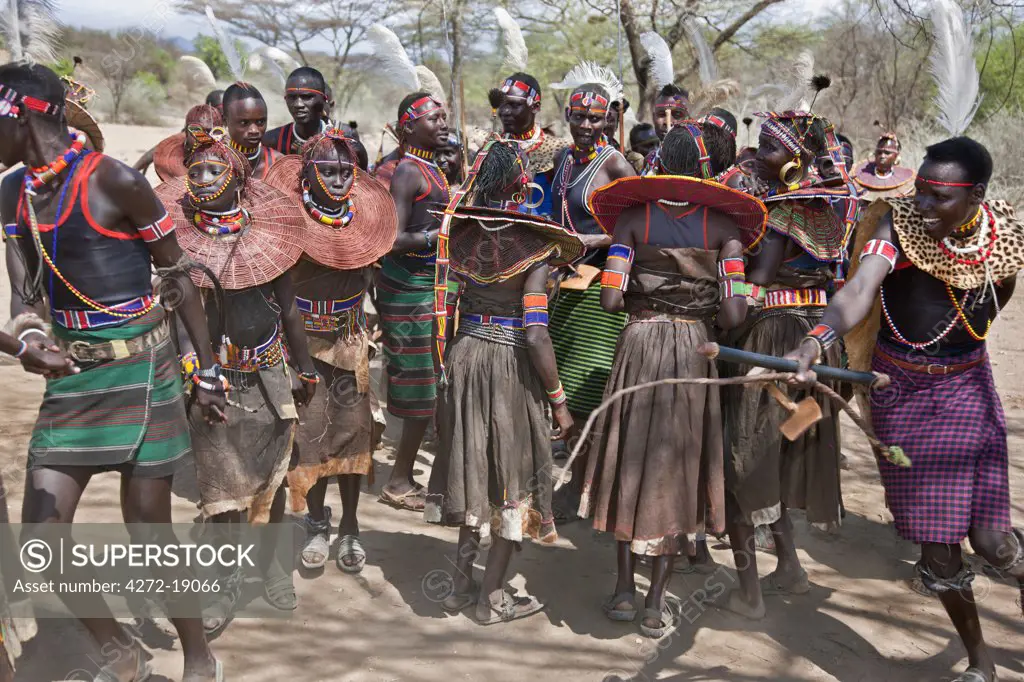 Pokot men, women and girls dancing to celebrate an Atelo ceremony. The Pokot are pastoralists speaking a Southern Nilotic language.