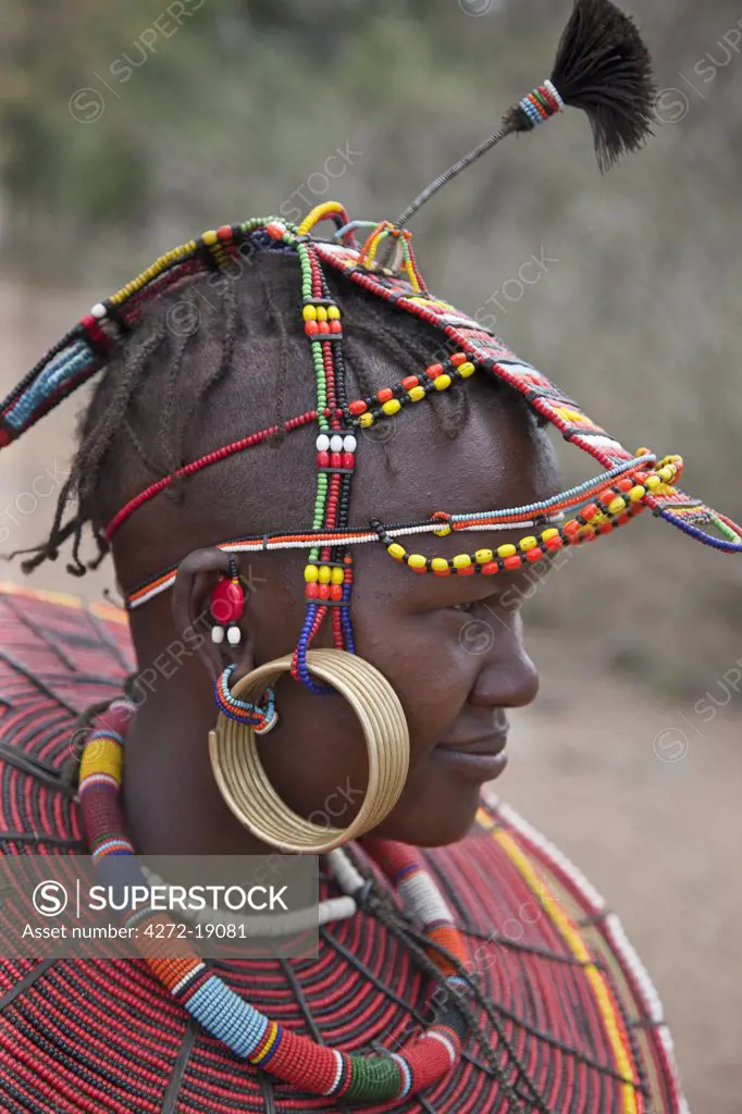 A young married Pokot woman wearing the traditional beaded ornaments of her tribe which denote her married status. The Pokot are pastoralists speaking a Southern Nilotic language.