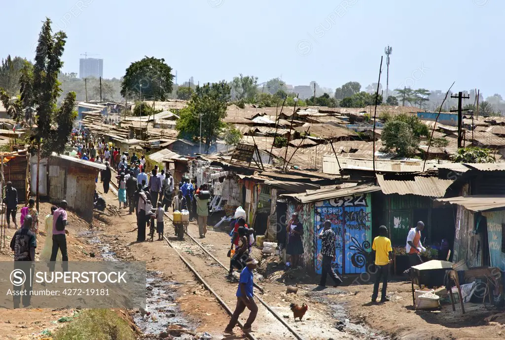 Kibera is the biggest slum in Africa and one of the largest in the world. It houses about one million people on the outskirts of Nairobi. The main railway line from Mombasa to Uganda runs through the middle of the slum.