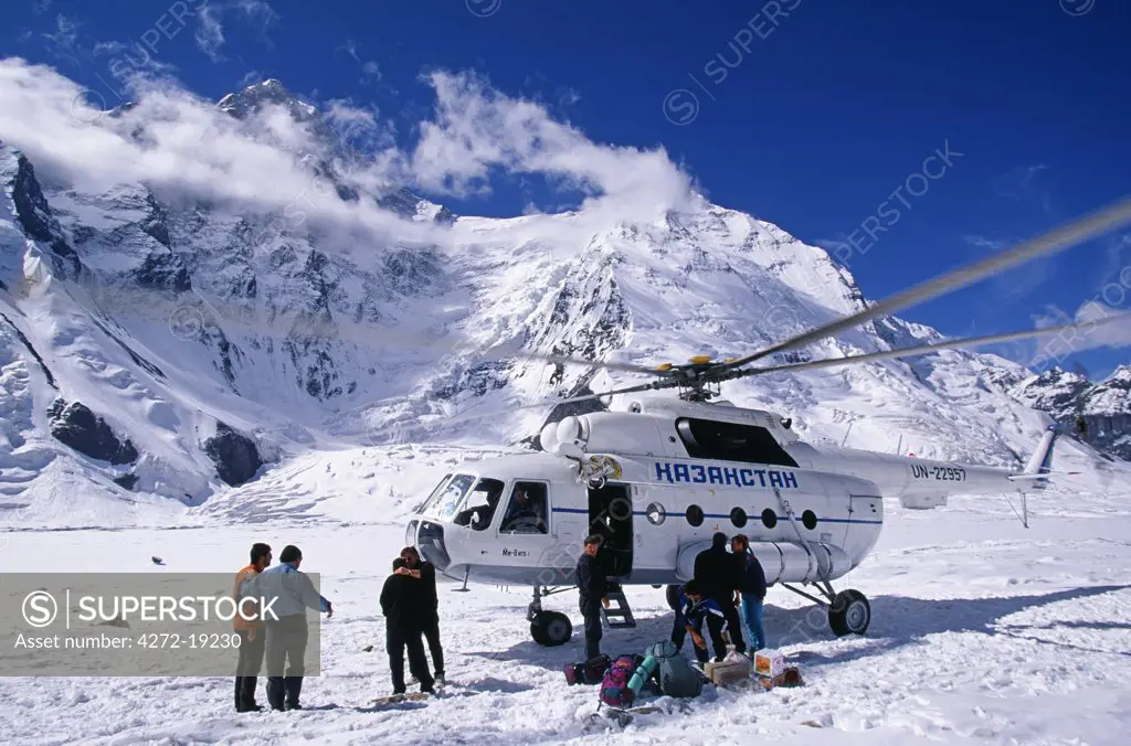 Kyrgyzstan, Tien Shan mountain range. Russian helicopter landing at Kang Tengri Base camp in the Tien Shan mountain range. The Chinese words Tien Shan translate as the Heavens Mountains or Celestial Mountains. A destination for hikers, climbers, and explorers, the Tien Shan Mountains are also a remote tourist spot.