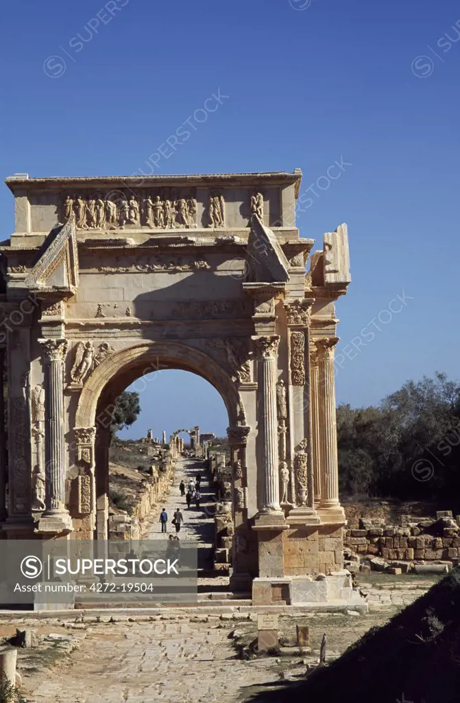 The Severan Arch in the ancient Roman city of Leptis Magna.  A large triumphal arch standing at the junction of the city's two main roads, the Severan Arch was built from limestone faced with marble.  One of the great works of Roman sculpture, the Severan Arch glorifies Emperor Septimus Severus.