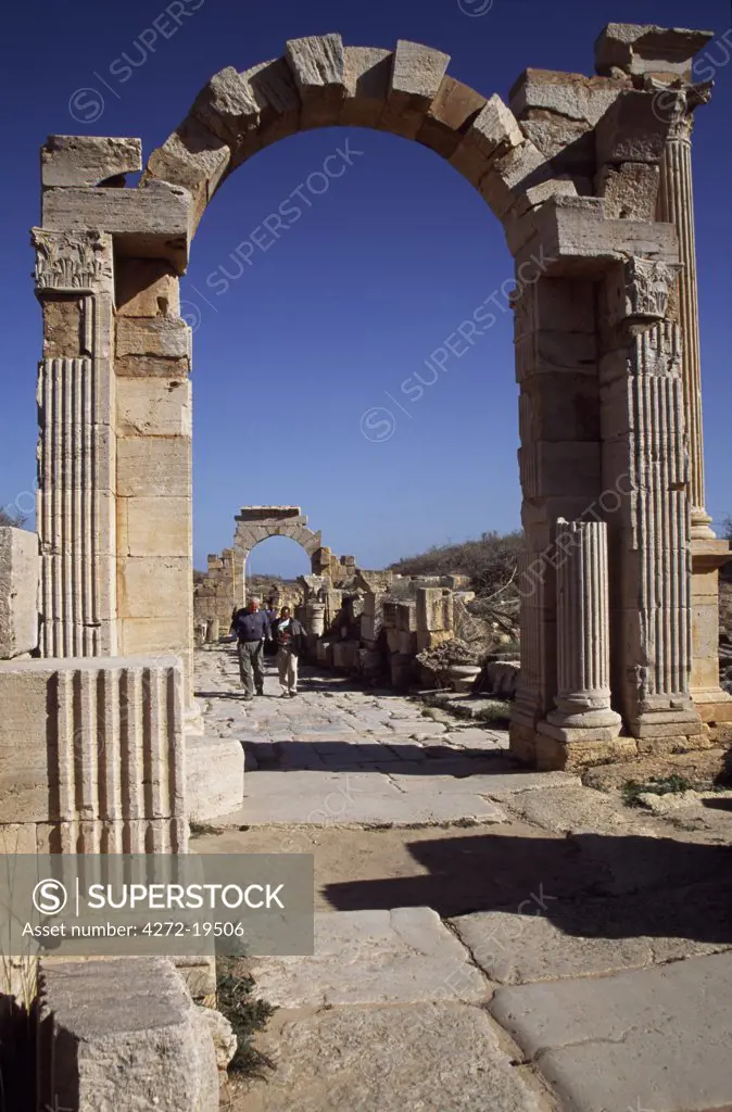 The Trajan Arch built in AD109-110 in the ancient Roman city of Leptis Magna.   The Arch of Tiberius (1st century Ad) can be seen behind.