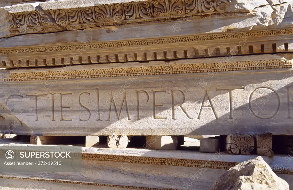 Detail of a carved Latin inscription on a portico of the Severan Basilica in the ancient Roman city of Leptis Magna.   Modelled on the Basilica Ulpia in the Trajan Forum in Rome, the Emperor Septimus Severan began building the Basilica which was completed by his son, Caracalla, in AD216.
