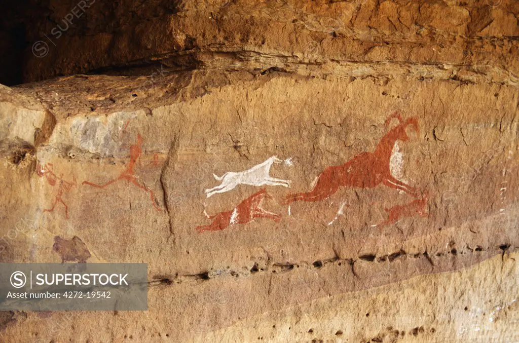 Rock painting depicting a hunting scene in the Jebel Acacus in the Libyan Sahara, Libya