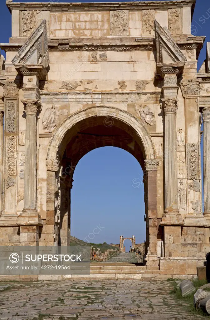 The Arch of Septimus Severus looking towards the Arch of Trajan, at Leptis Magna, Libya.