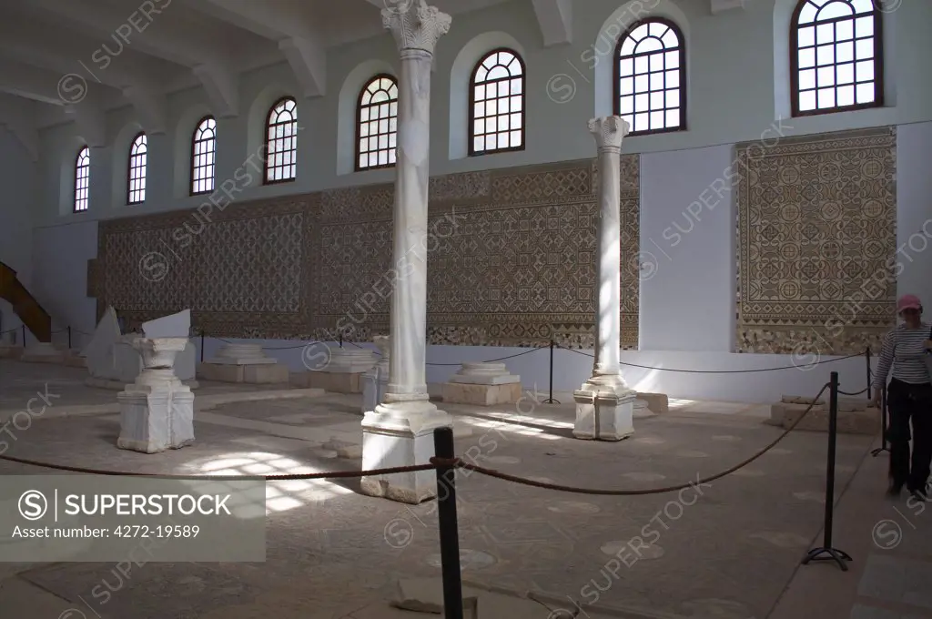 Interior of the Roman museum in Sabratha, Libya, with mosaics from the Basilica of Justinian on the walls and floor. The mosaic on the floor is from the central nave, and those on the walls from the basilica's two aisles.
