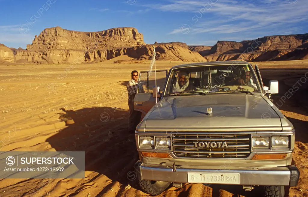 Libya; Fezzan; Jebel Akakus. A 4WD pauses in the wilds of Wadi Teshuinat in the Jebel Akakus.