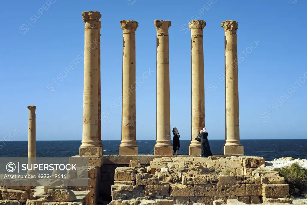 Libya, Sabratha. Arab tourists taking photographs.