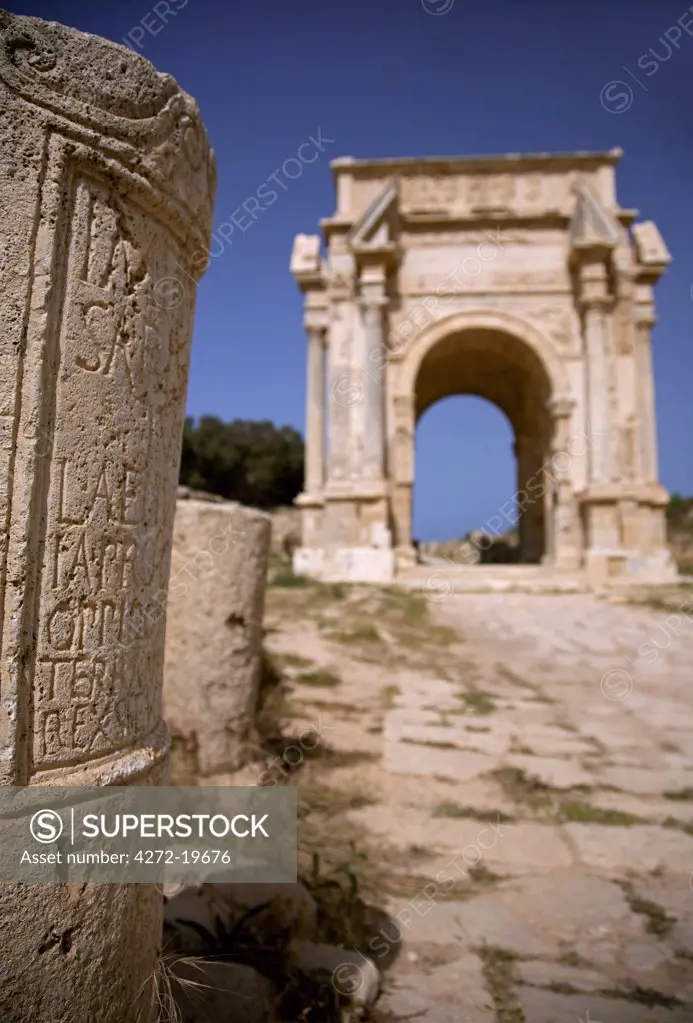 Libya; Tripolitania; Khums; An inscription on a stone and the Arch of Septimius Severus.