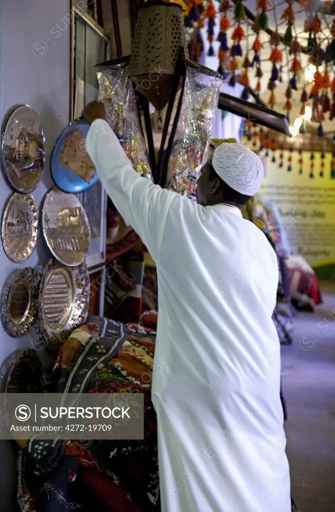 Tripoli, Libya; At the Ancient Medina of Tripoli a vendor putting a souvenir on display in one of the shops