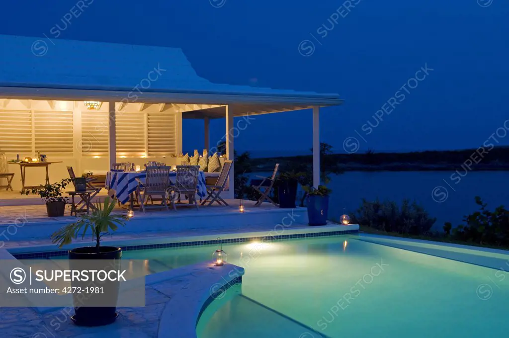 The infinity pool at Little Whale Cay lit up at night