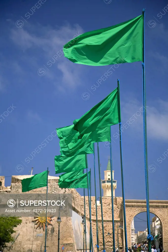 Tripoli, Libya; Libyan flags prominently displayed on Green Square in front of the entrance to the old Medina of Tripoli