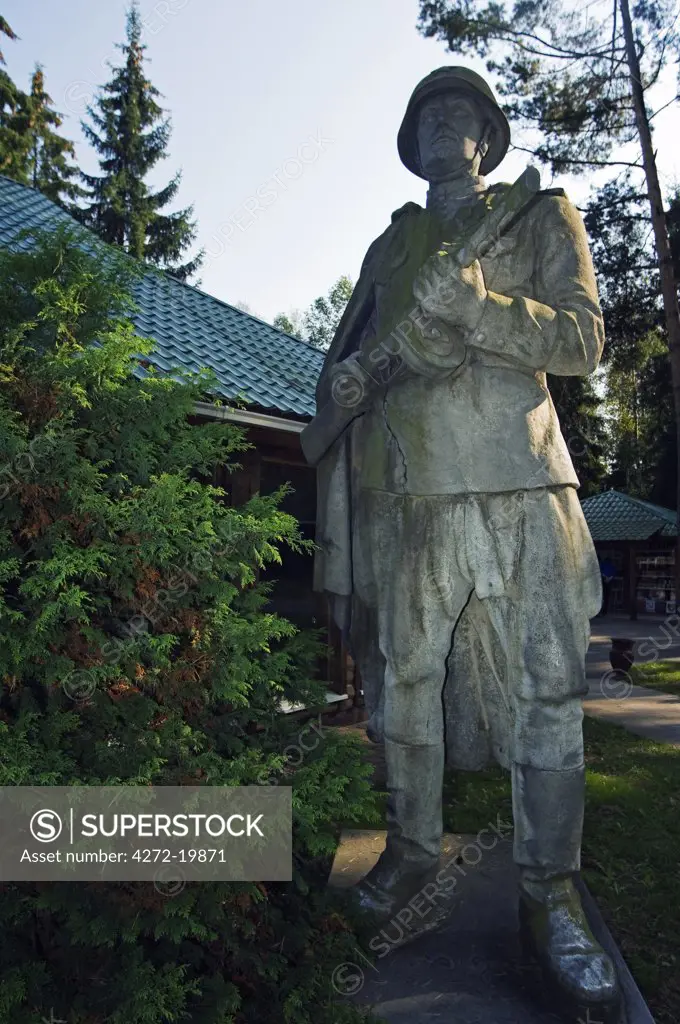 Lithuania, Druskininkai. A memorial statue of soldier in Gruto Parkas near Druskininkai - a theme park with Soviet sculpture collections of Lenin and Stalin.