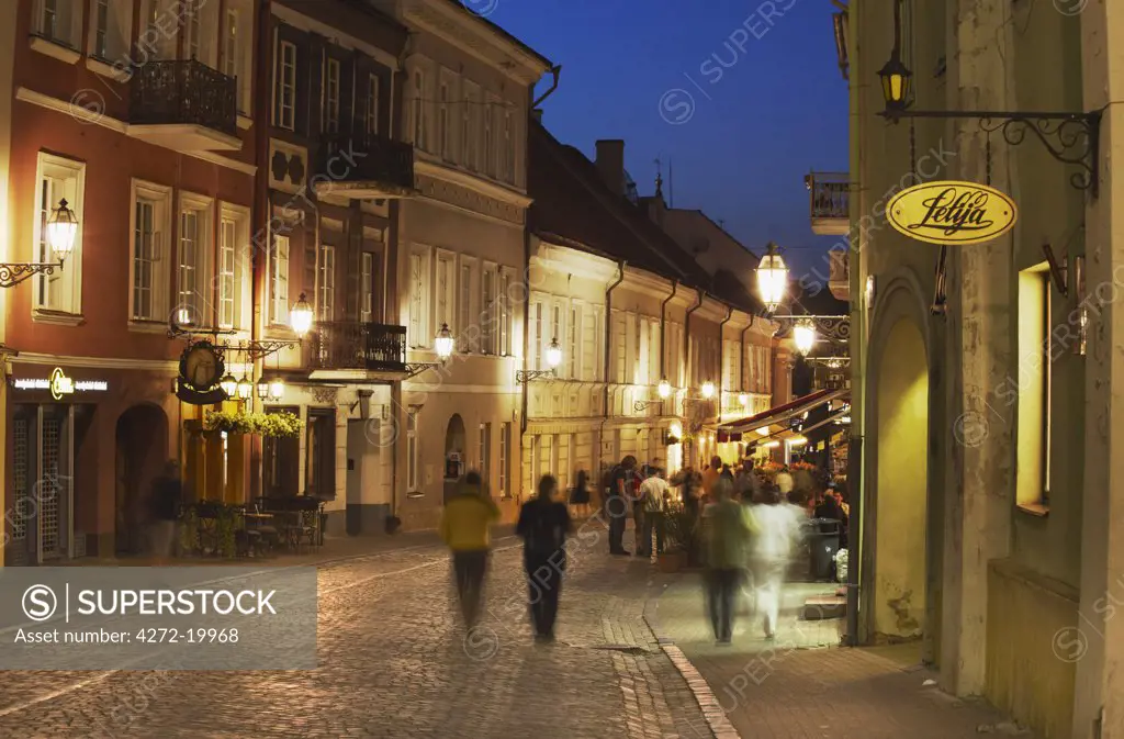 Lithuania, Vilnius, People Walking Along Pilies Gatve At Dusk