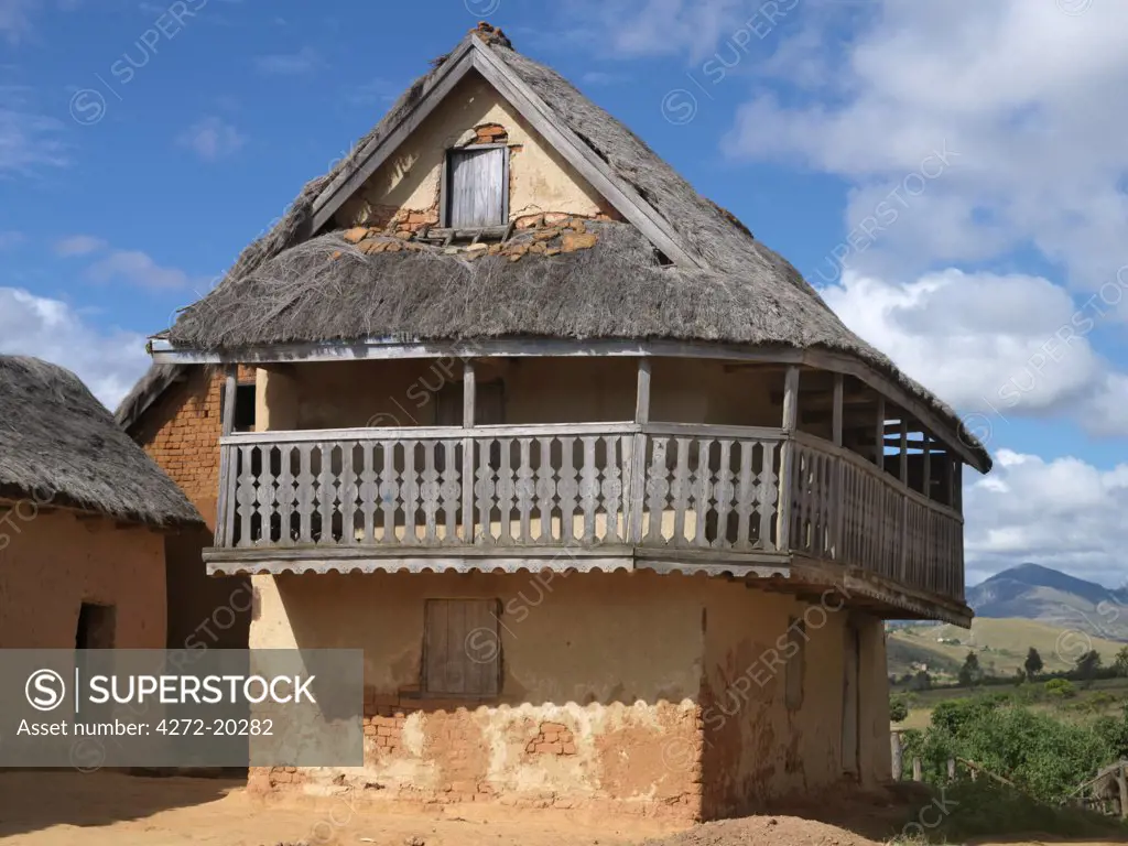 A typical double-storied Malagasy highland house with a carved balcony.