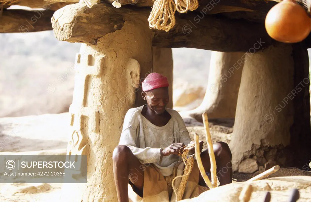 Local chieftain in Dogon Village built into cliff at the base Bandiagara plateau ,designated a UNESCO World Heritage Site in 1989