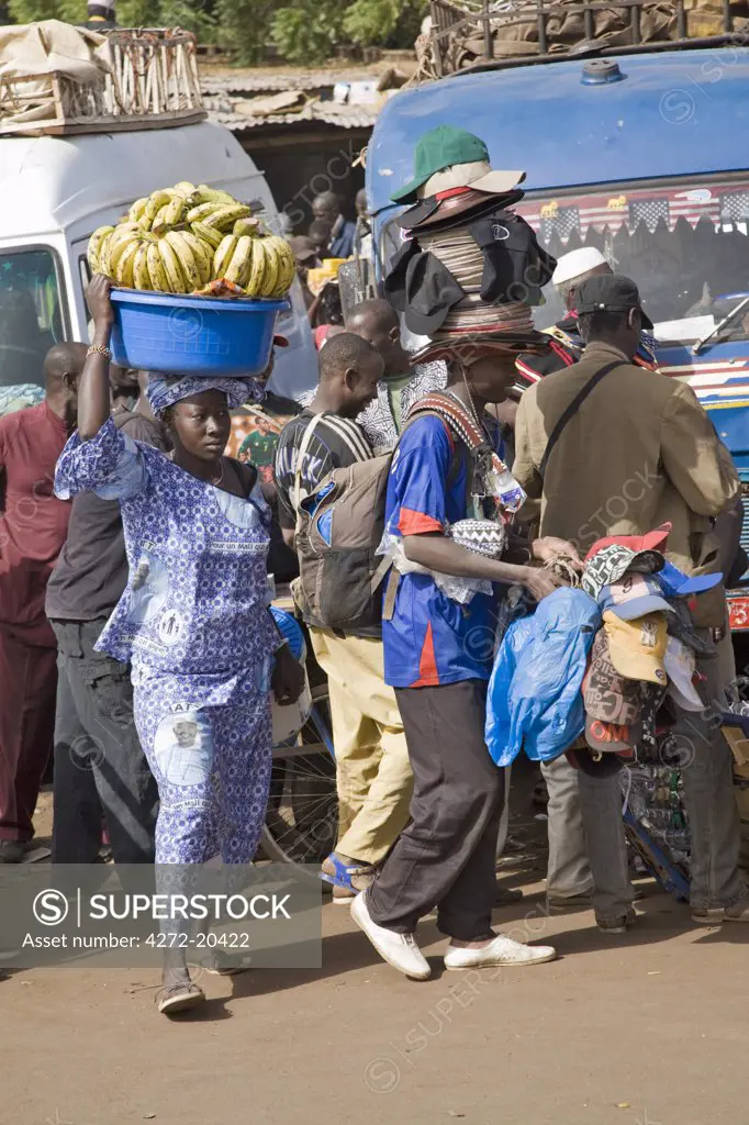 Mali, Bamako. Hawkers at one of Bamako's country bus stations where well-loaded vehicles leave for various destinations in the country when they are full.