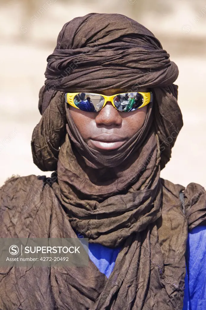 Mali, Douentza. A cool dude! A Bella man wearing a turban and reflective sunglasses.  The Bella are predominantly pastoral people and were once the slaves of the Tuareg of Northern Mali.