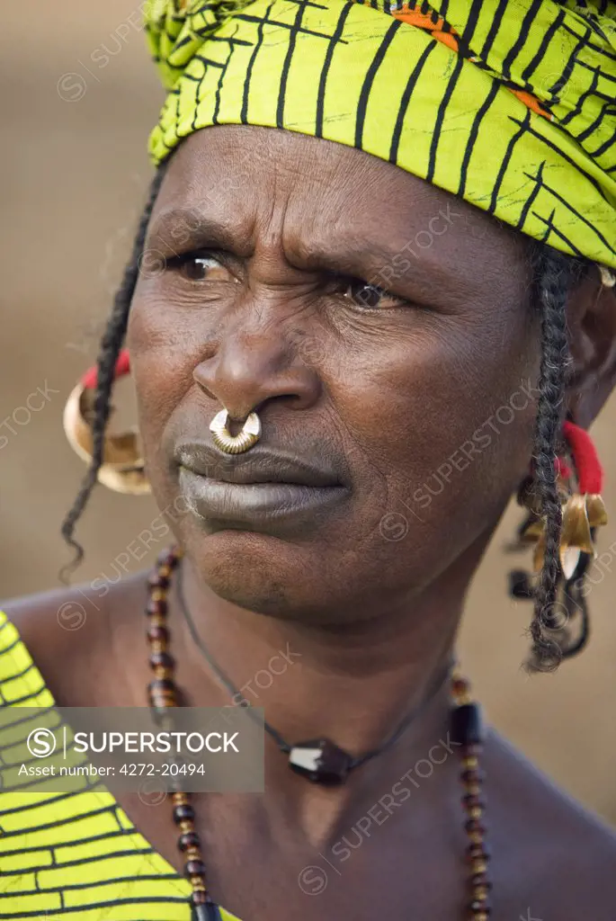 Mali, Douentza. A Bella woman wearing gold jewellery in her village near Douentza.  The Bella are predominantly pastoral people and were once the slaves of the Tuareg of Northern Mali.